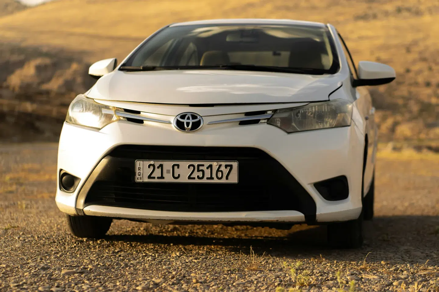 White Toyota viewed from the front, parked on a track